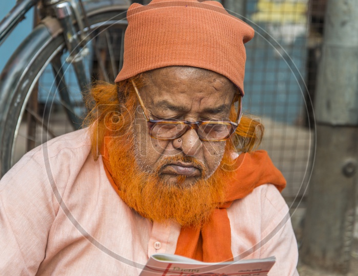 Old Muslim Man reading book