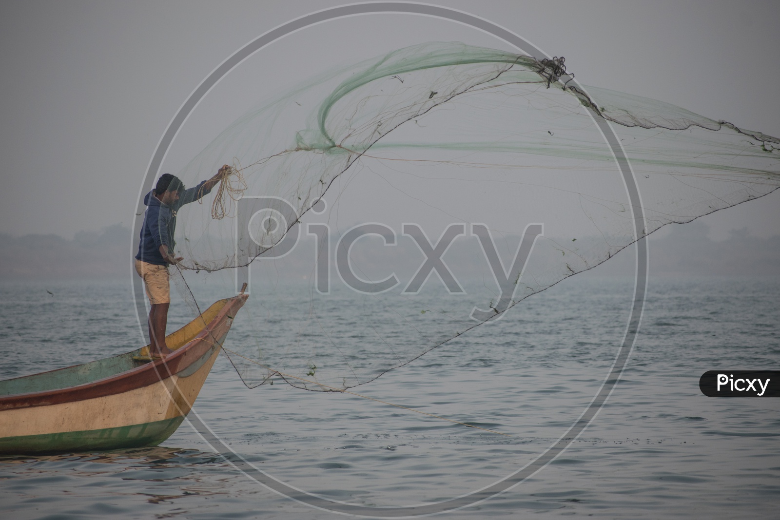 Young Fisherman Casting his Net
