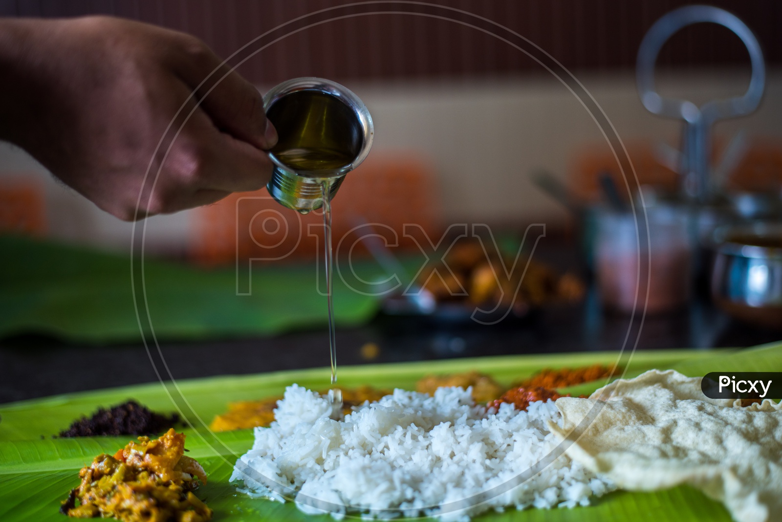 Ghee being poured in Andhra Meals.