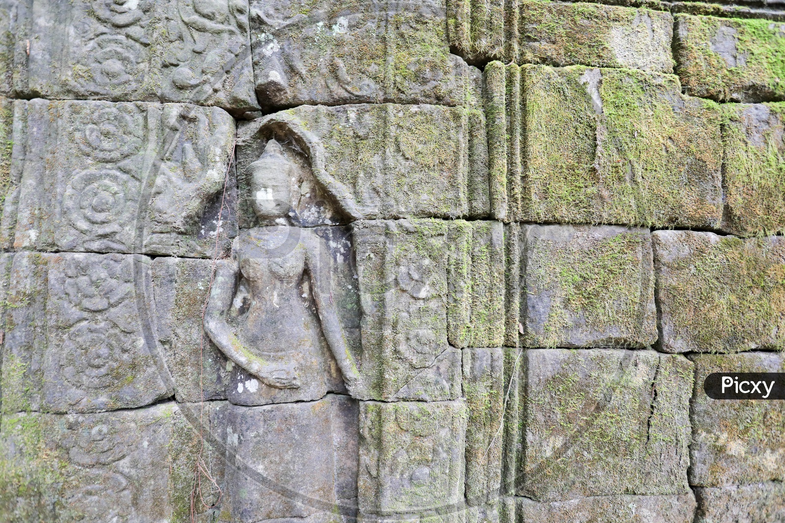 Ancient Statue on Wall Near Ta Prohm