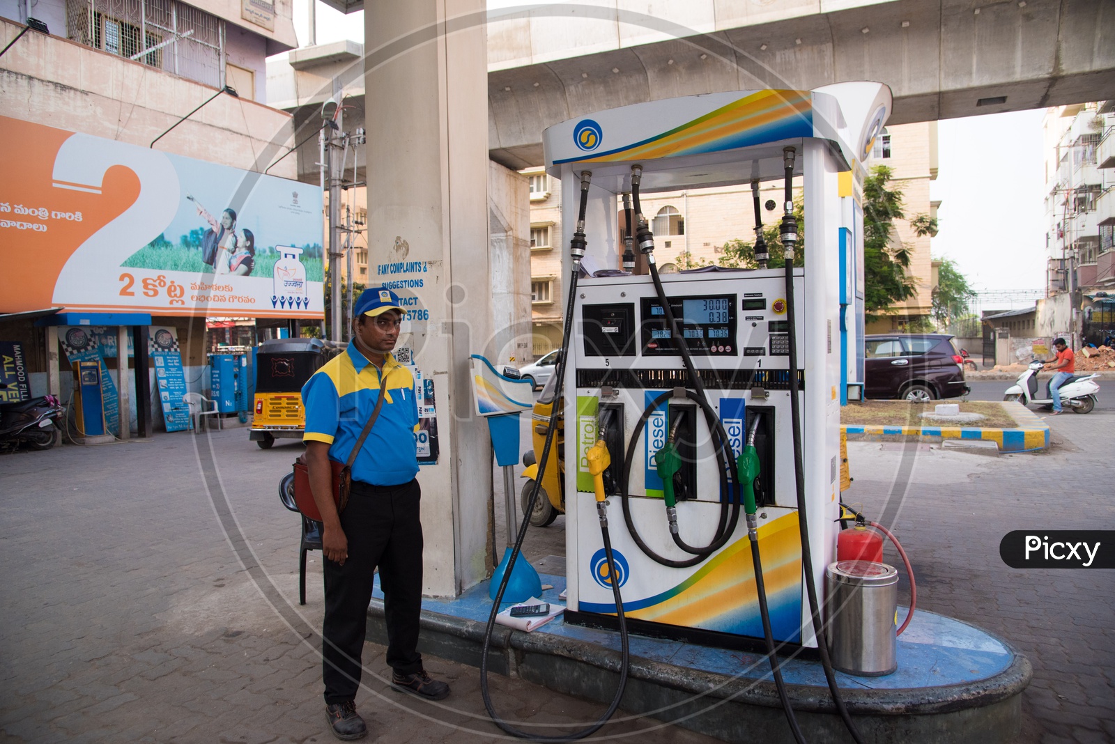 Fuel attendant at a gas station in Hyderabad
