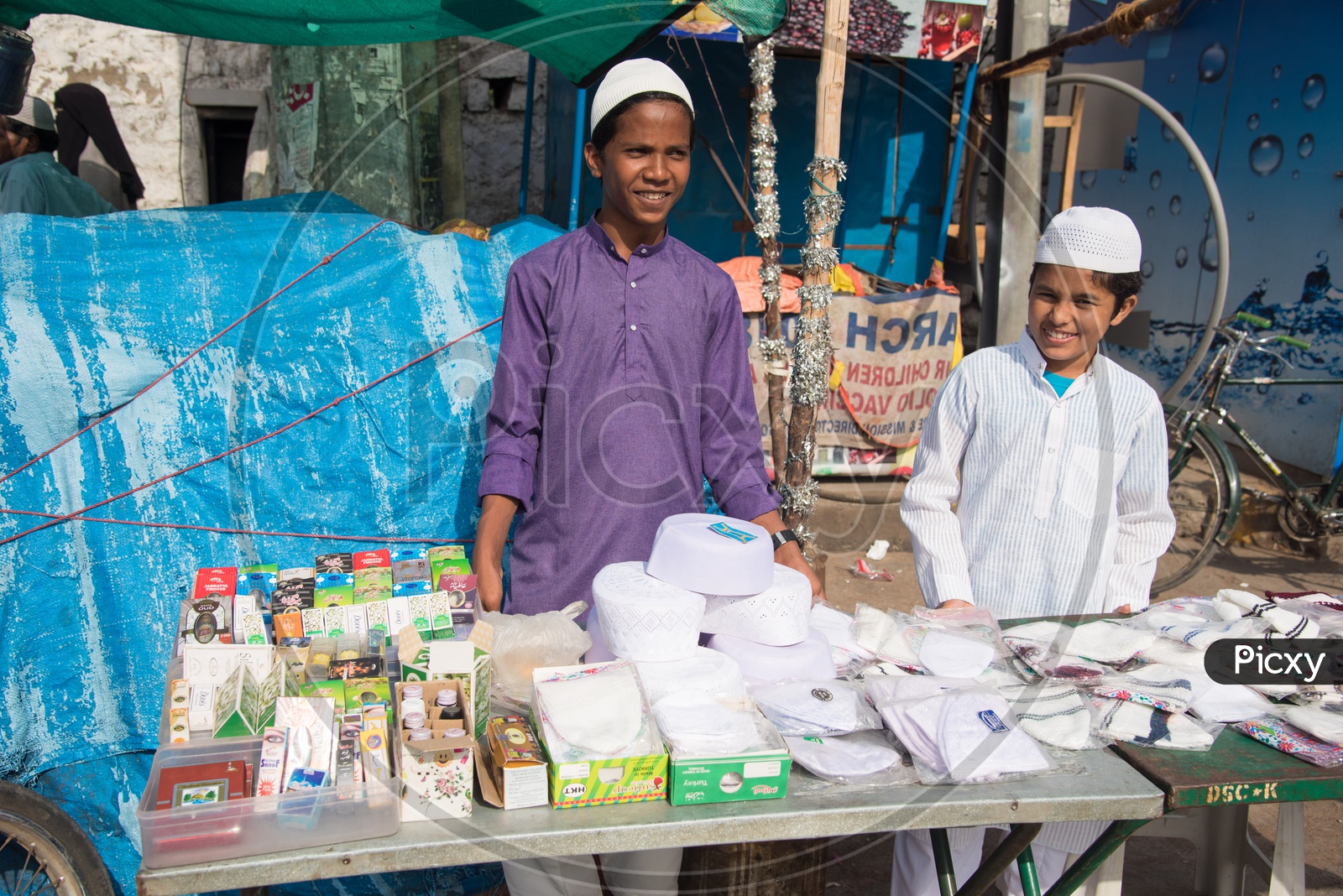 Kids selling Attar and caps during Eid festivities in Hyderabad