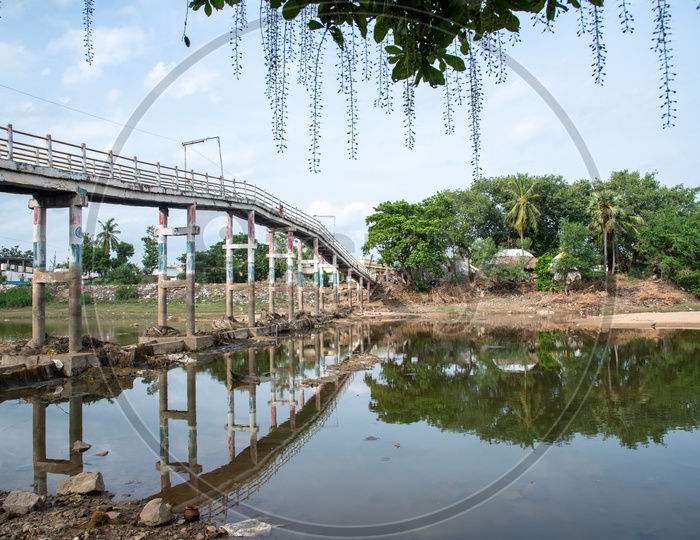 Reflection of a Bridge on Buckingham Canal in Revendrapadu