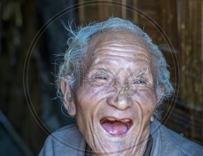 Smiling old man in Apatani Tribes, Hija Village, Ziro