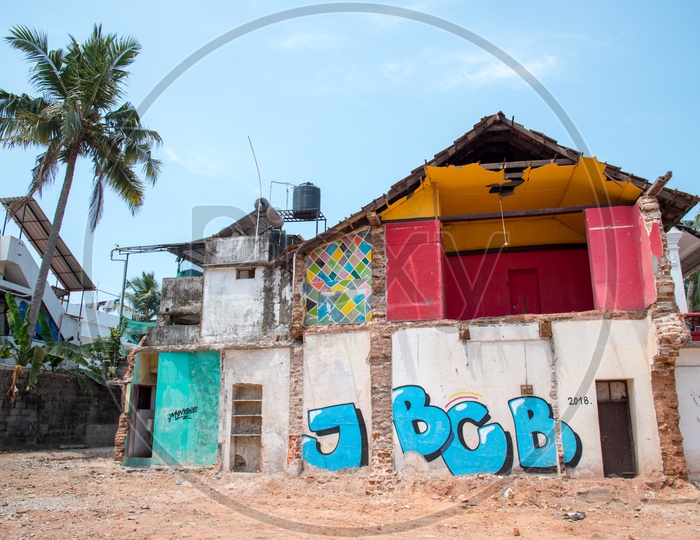 Graffiti works on a broken house at Fort Kochi ,Kerala.