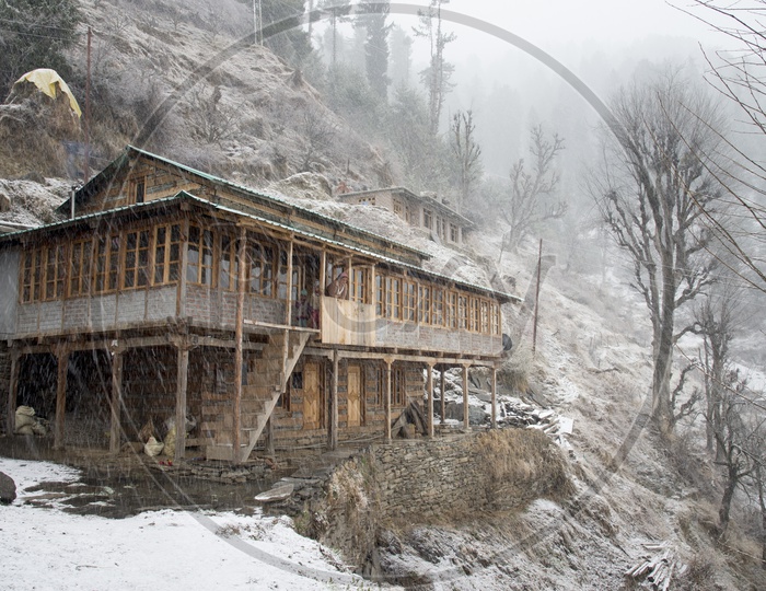 Snow Covered Houses at Jana Village near Manali