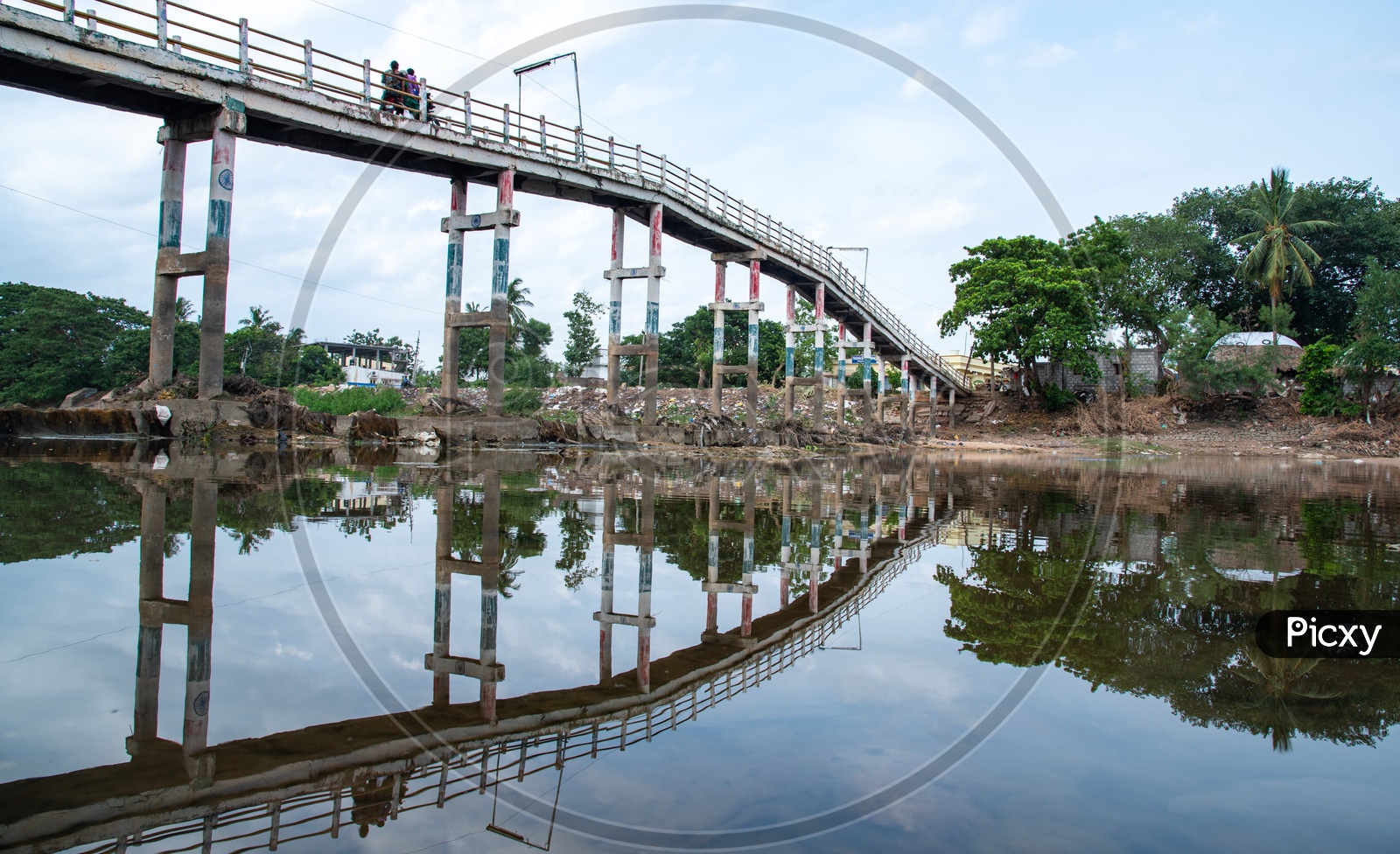 commuters using the small bridges on Buckingham Canal on Revendrapadu Bridge, Andhra Pradesh, India