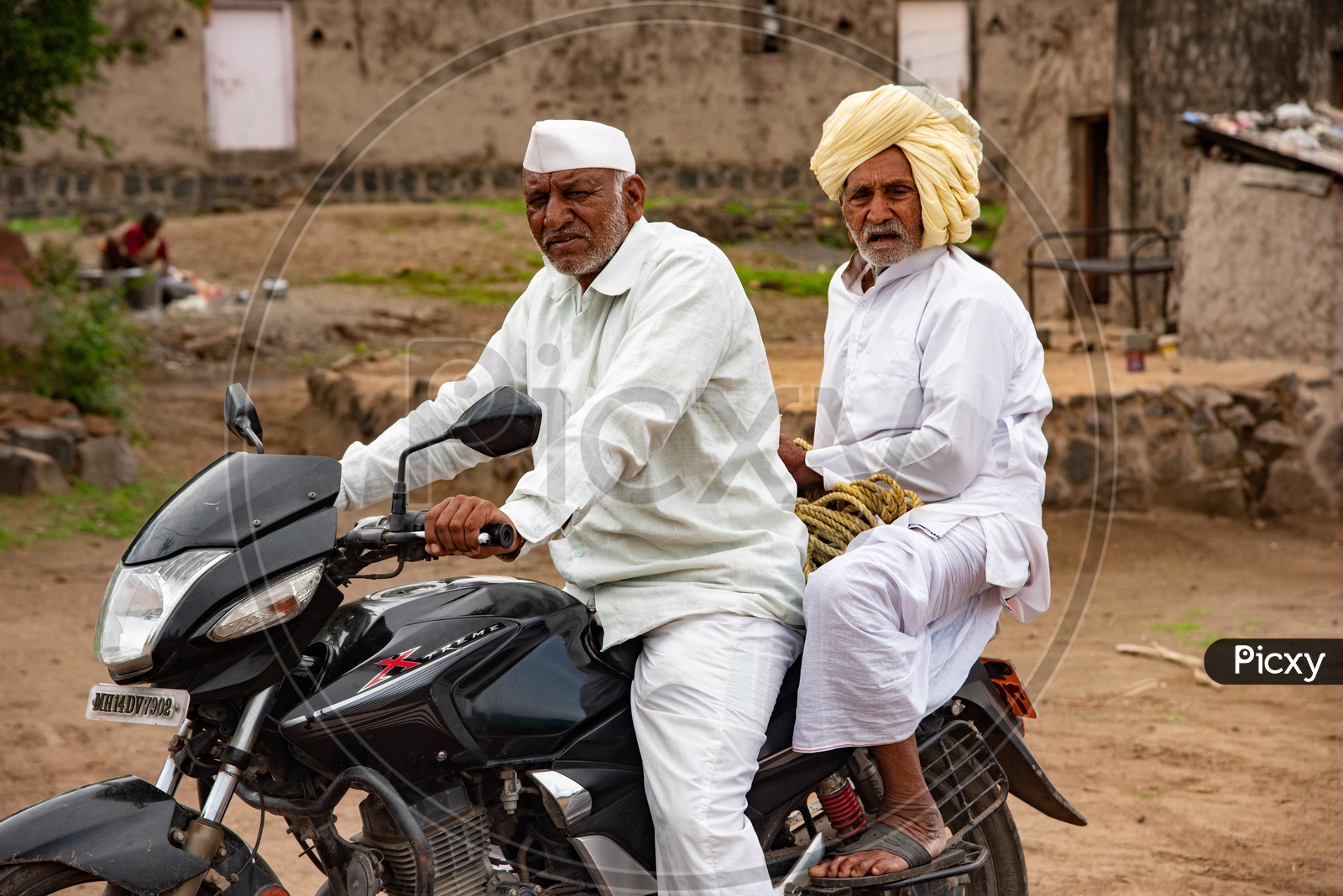 Farmer with his elderly father  in a village in Maharashtra