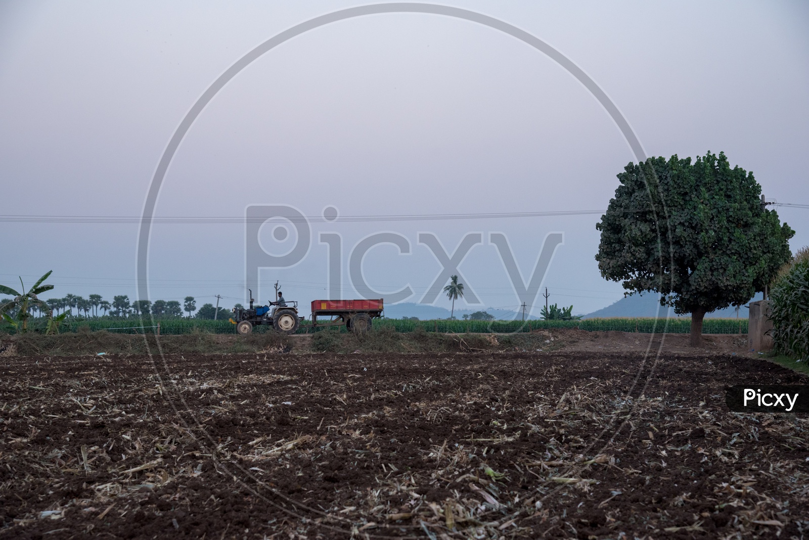 tractor passing by the fields