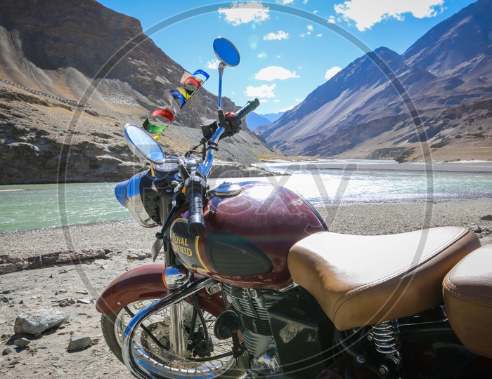Royal enfield bullet amidst hills and mountains of Leh Ladakh