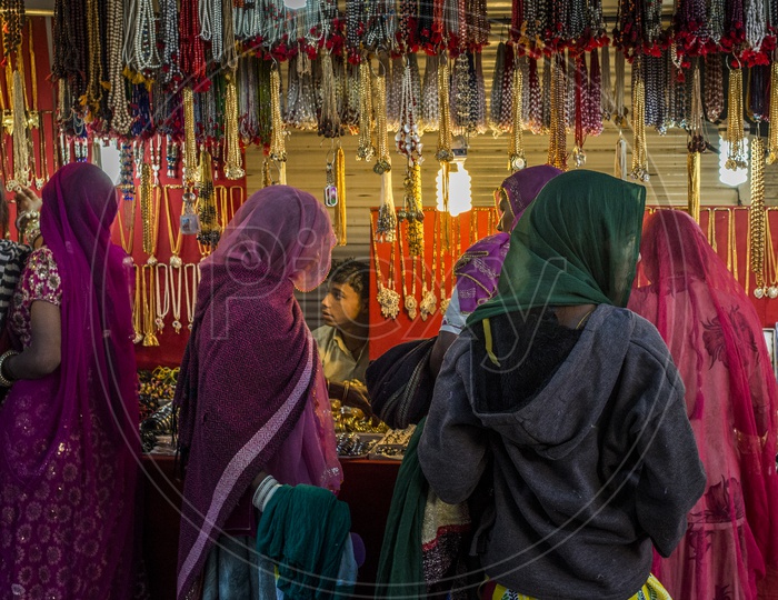 Rajasthani Ladies Shopping at Shop during Pushkar Fair, Rajasthan