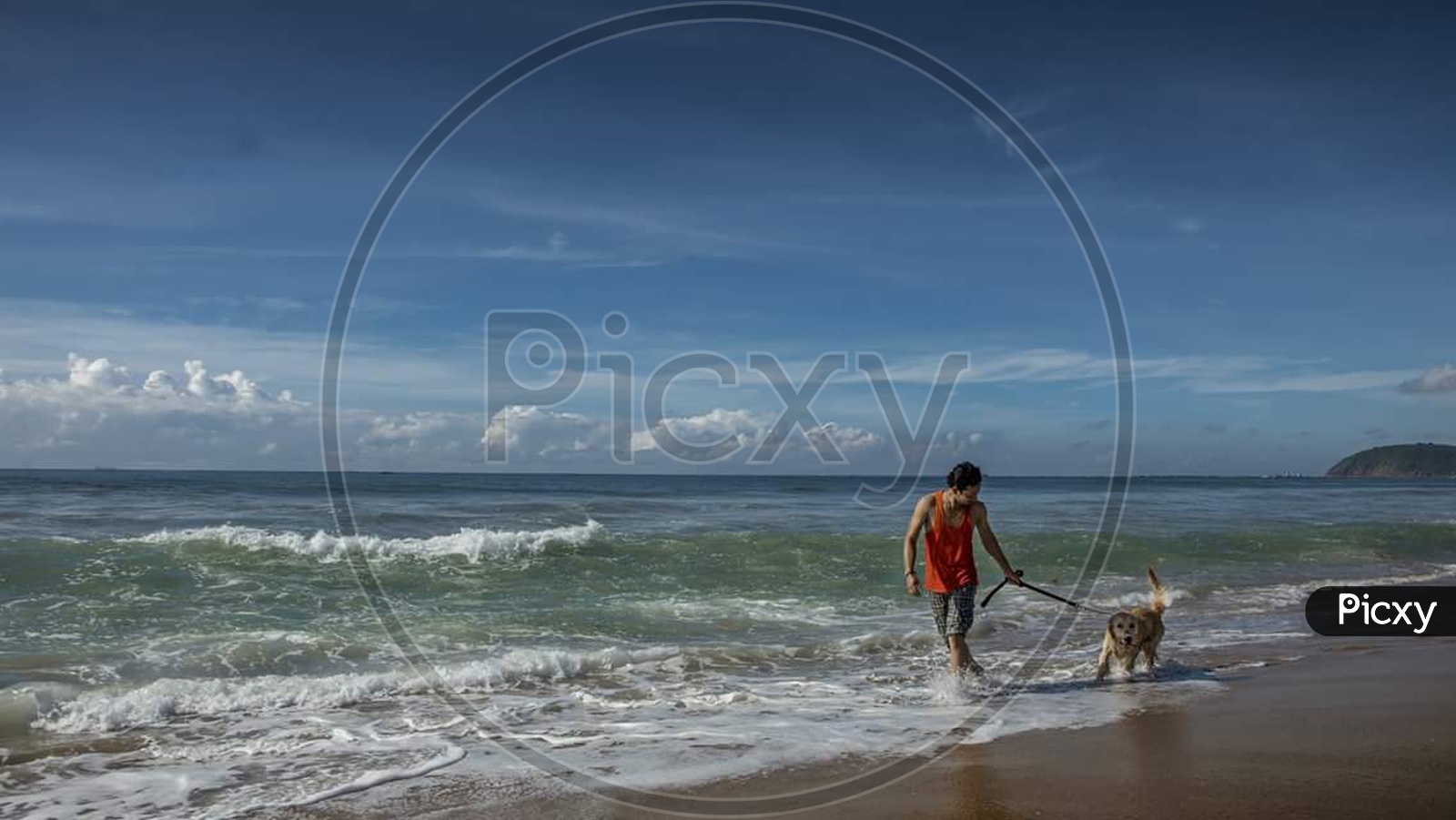 Man with dog near Beach