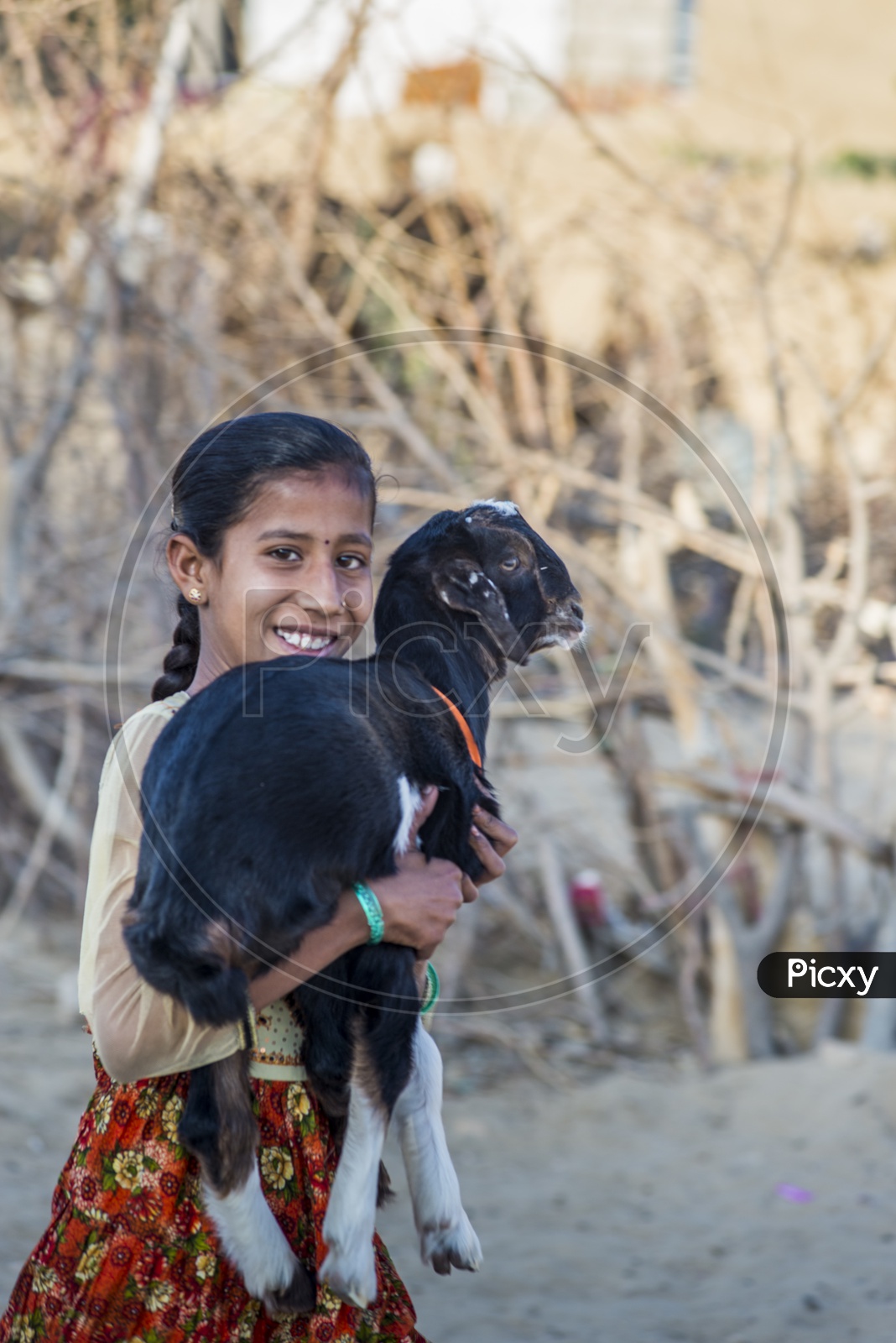 Smiling girl with Goat
