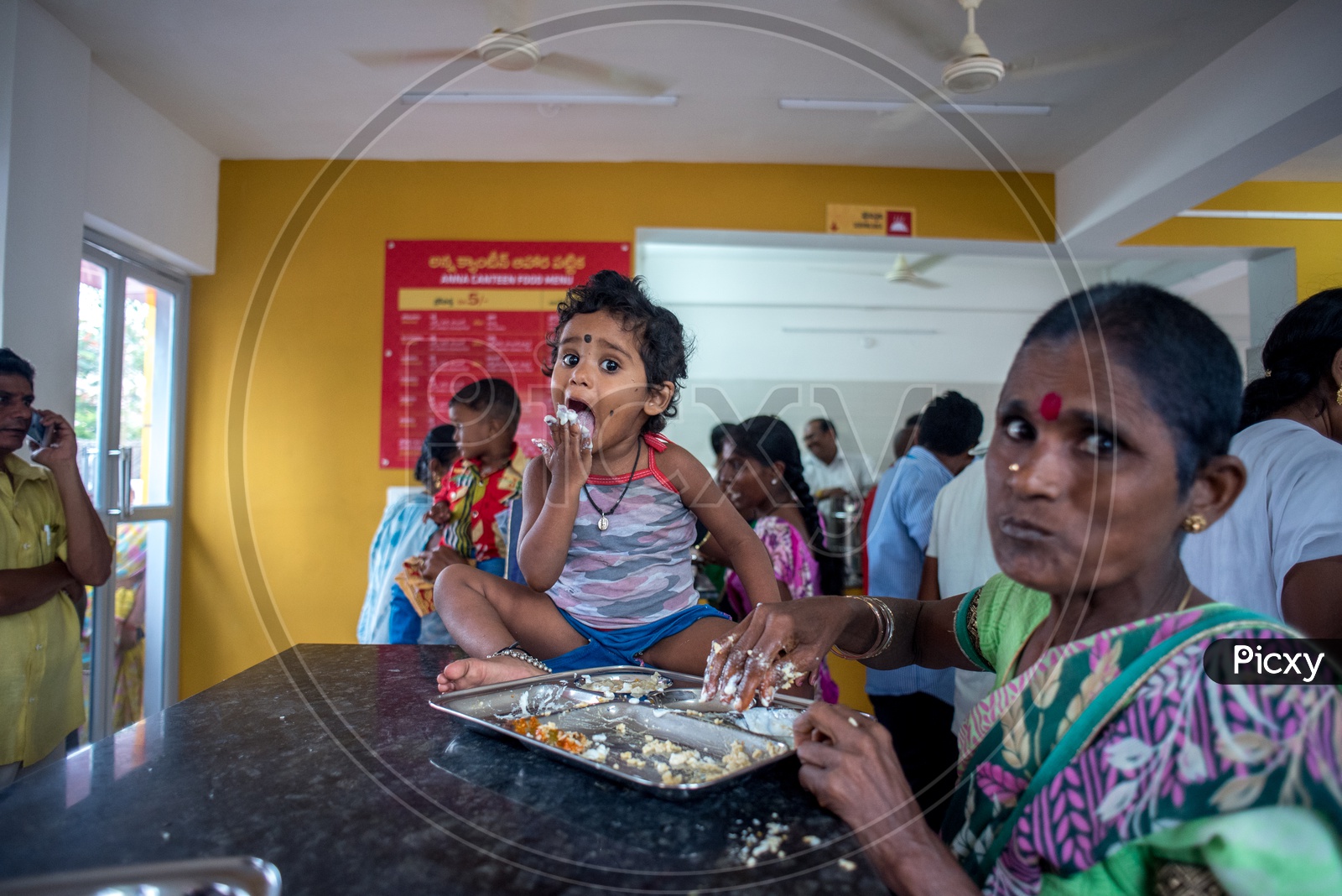a kid having food in anna canteen