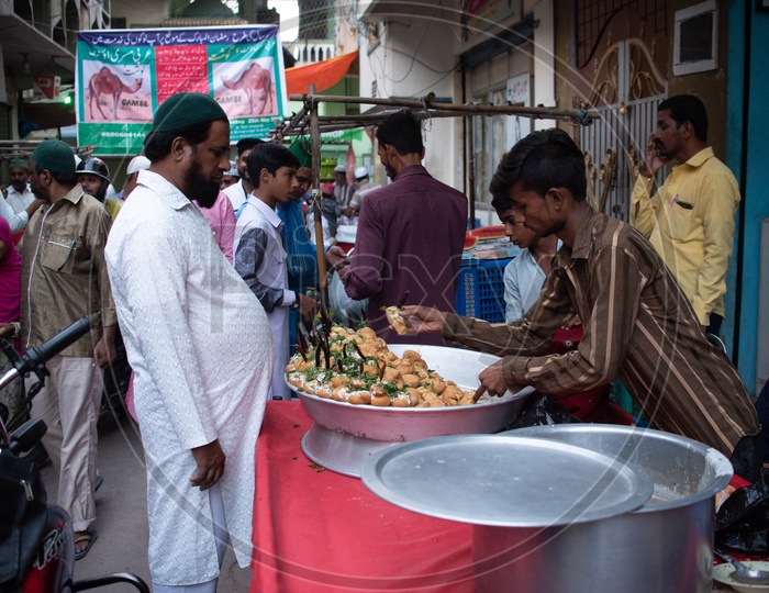 Vendor selling Dahi Vadas during Iftar time of Ramadan
