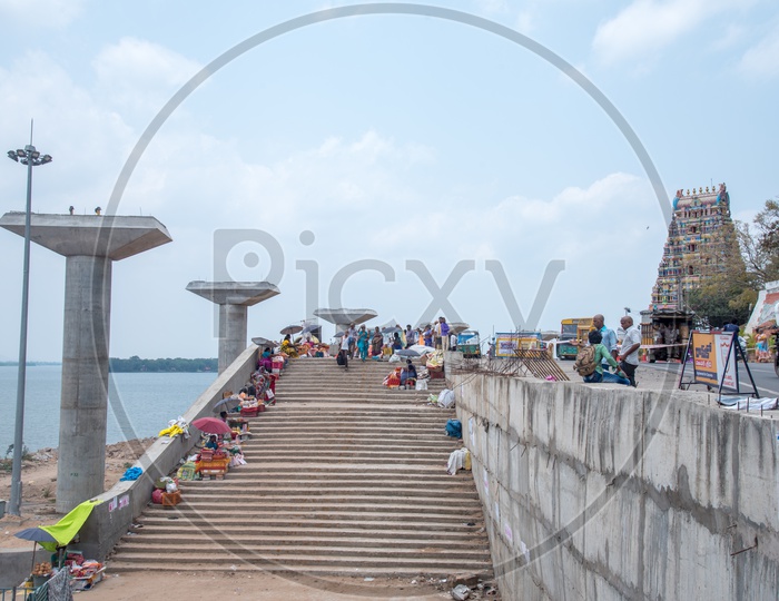 People getting down to have a bath after offering their hair to Kanaka Durga Amma, Vijayawada.