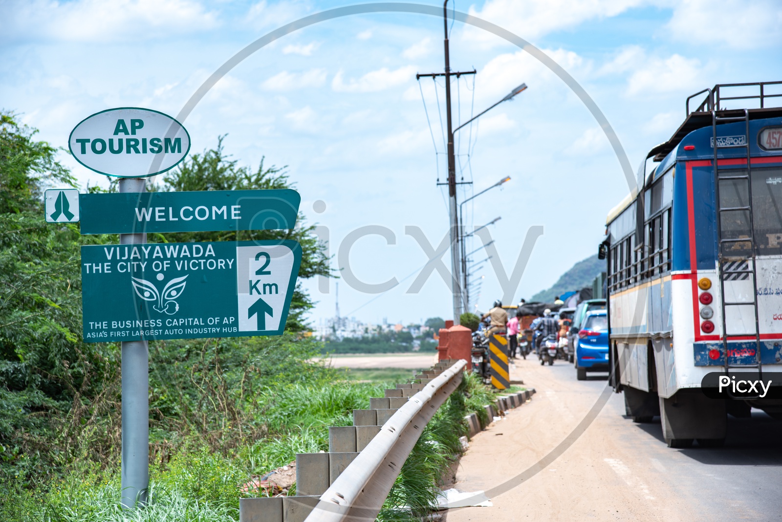 AP Tourism Information Board at Krishna Varadhi Bridge Entrance saying welcome to Vijayawada.