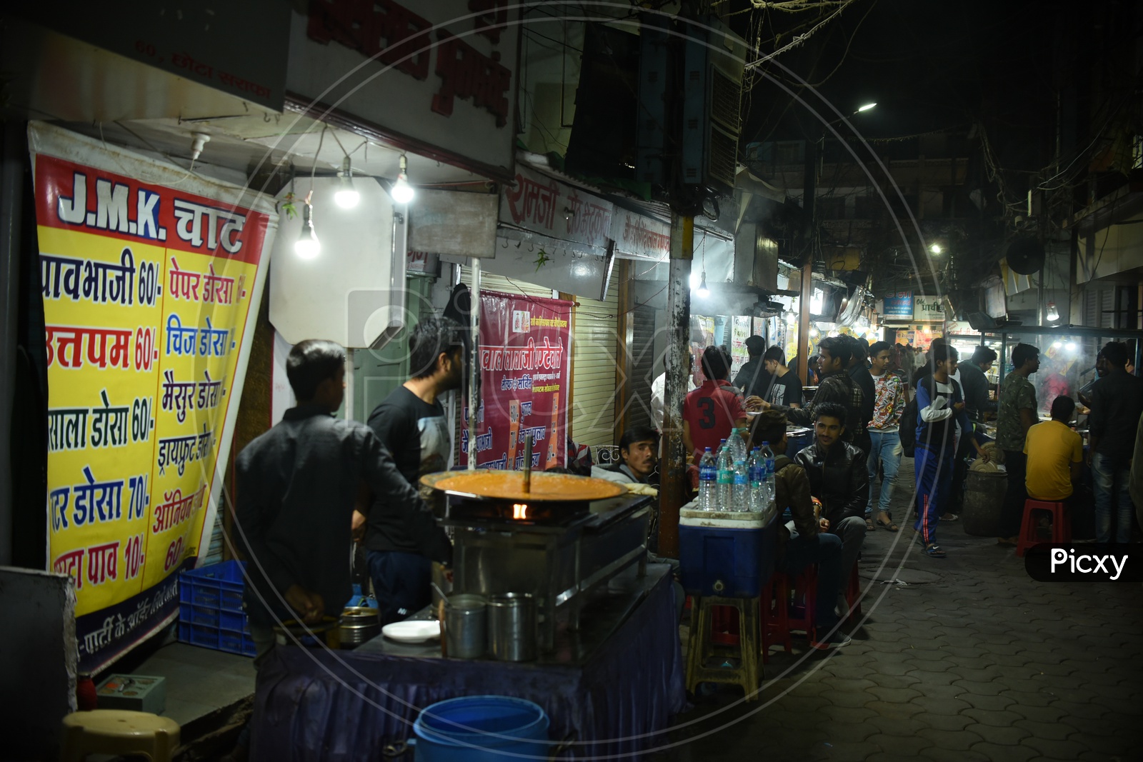 Sarafa Bazaar night street food stalls.