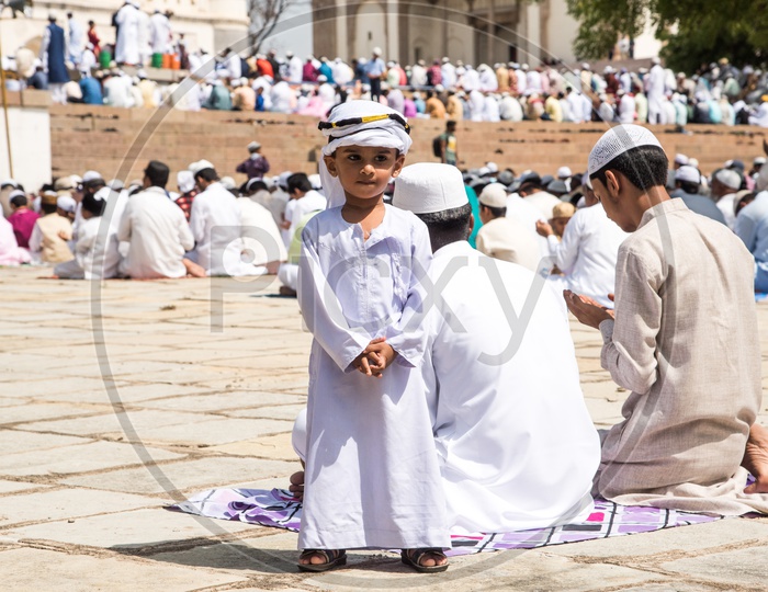 Kid dressed in Arabic robe during Eid