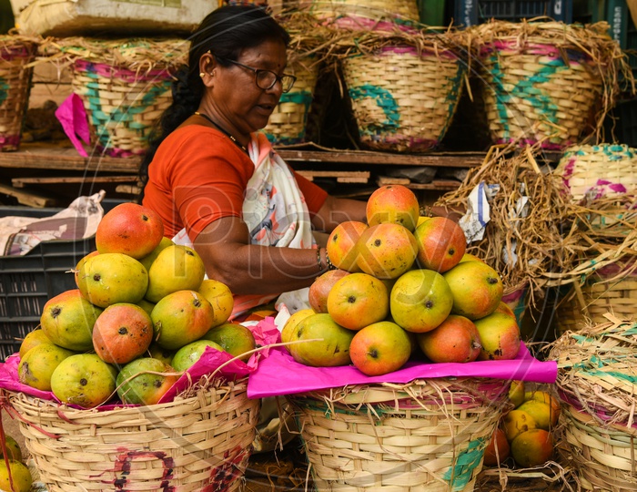 Woman selling Mangoes
