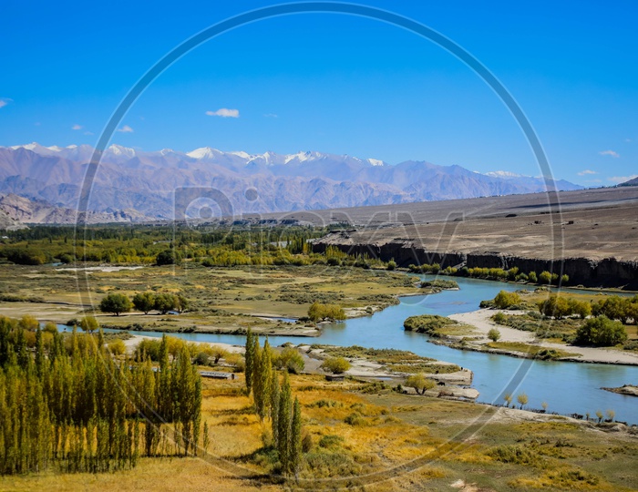 Indus River flowing amidst Hills and Mountains of leh ladakh