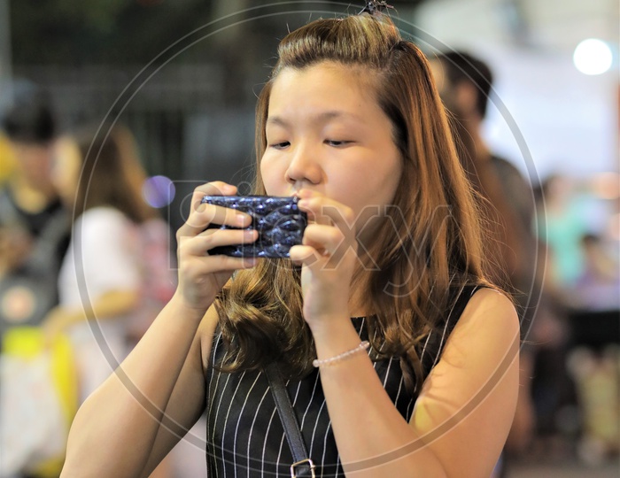 Vietnamese Girl taking a Picture