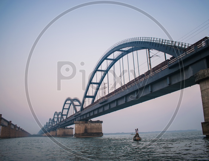 Godavari Arch Bridge and A Fisherman
