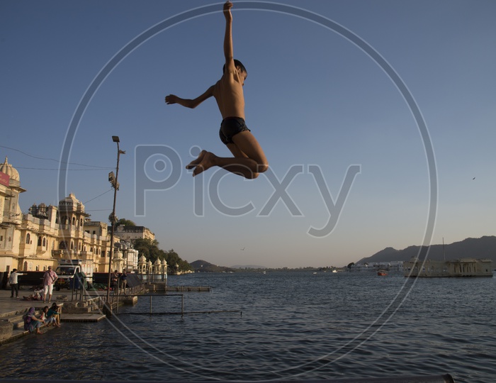 Kid Jumping into the water