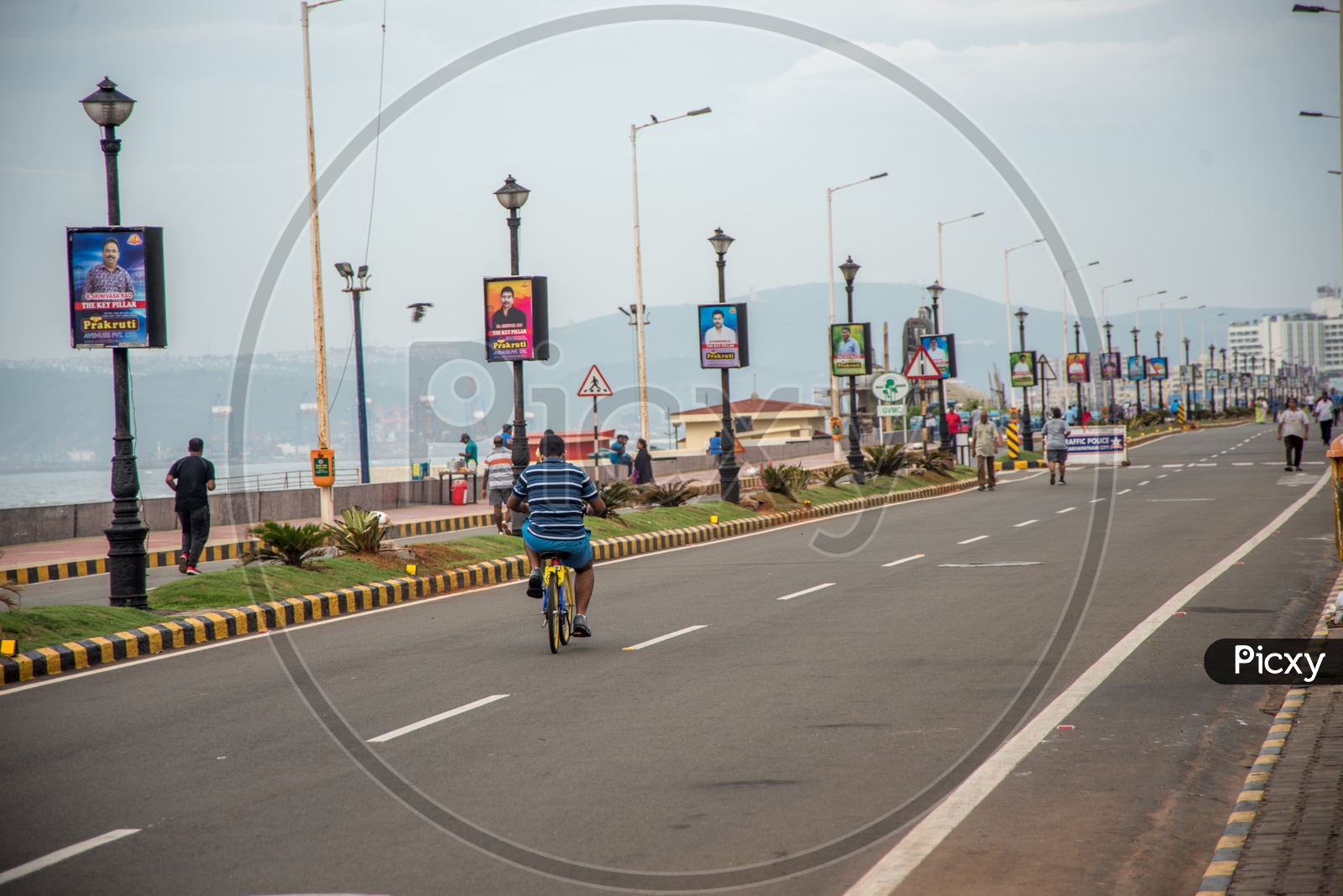 walkers and cyclists on the beach road