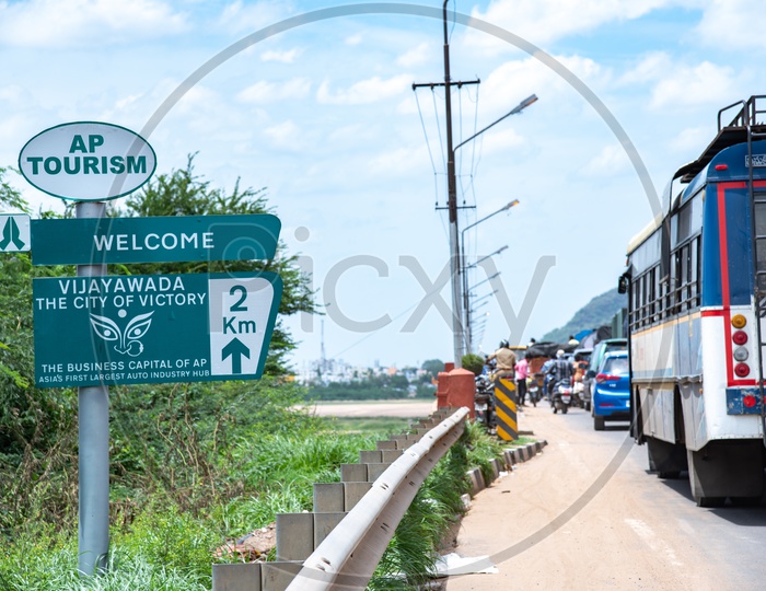 AP Tourism Information Board at Krishna Varadhi Bridge Entrance saying welcome to Vijayawada.
