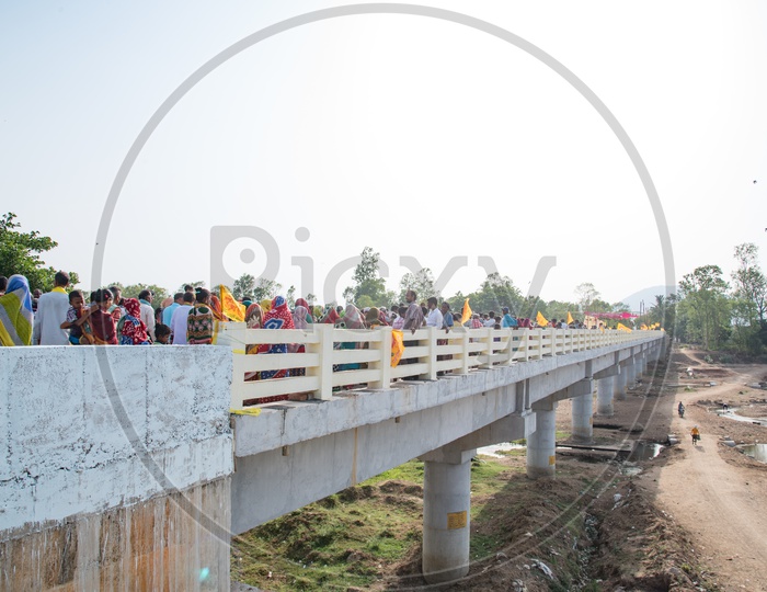 People walking for the First Time on the Bridge built recently on Bahudha River, Boddabada.