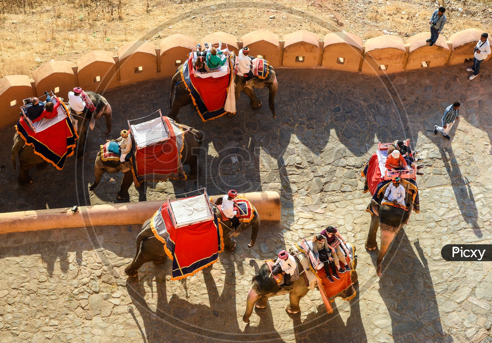 Tourists riding atop Elephants in Amer Fort