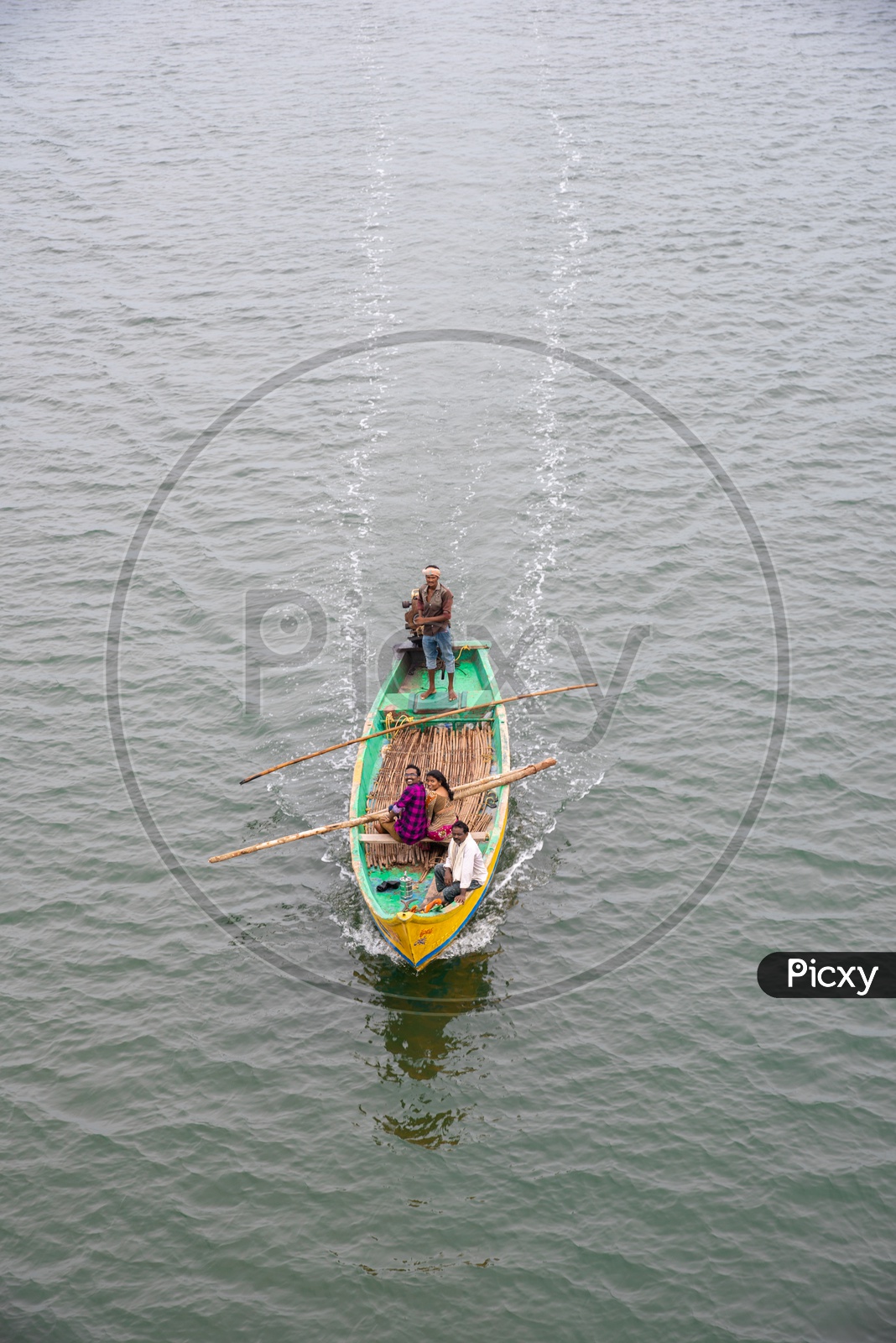 Tourists on a Fishing Boat sailing in River Krishna.