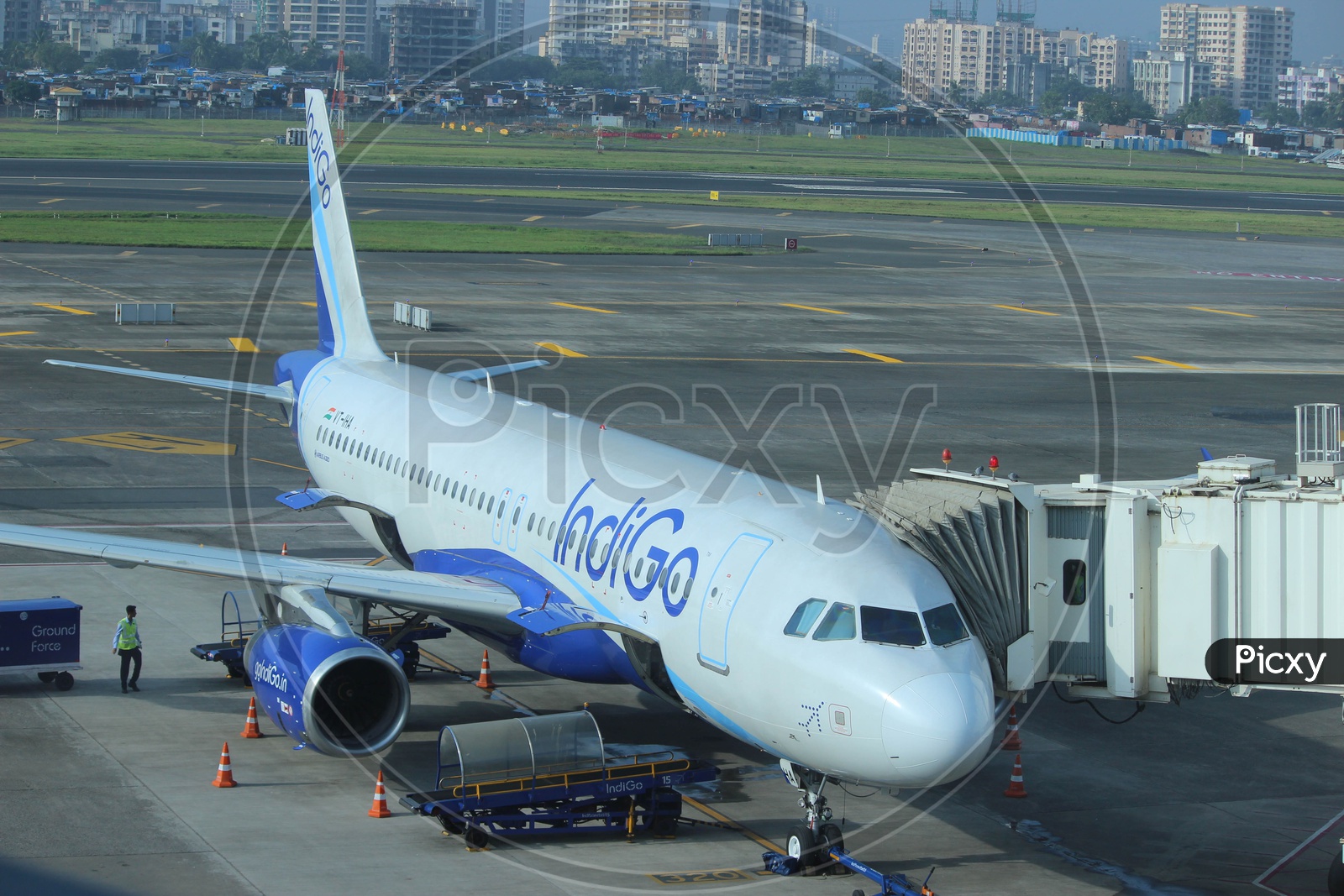 IndiGo airlines A320 waiting for passengers to board at mumbai international airport.