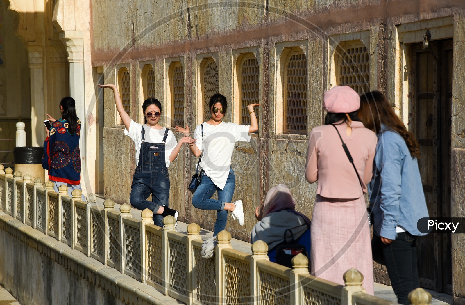 Japanese tourists trying some fun poses.