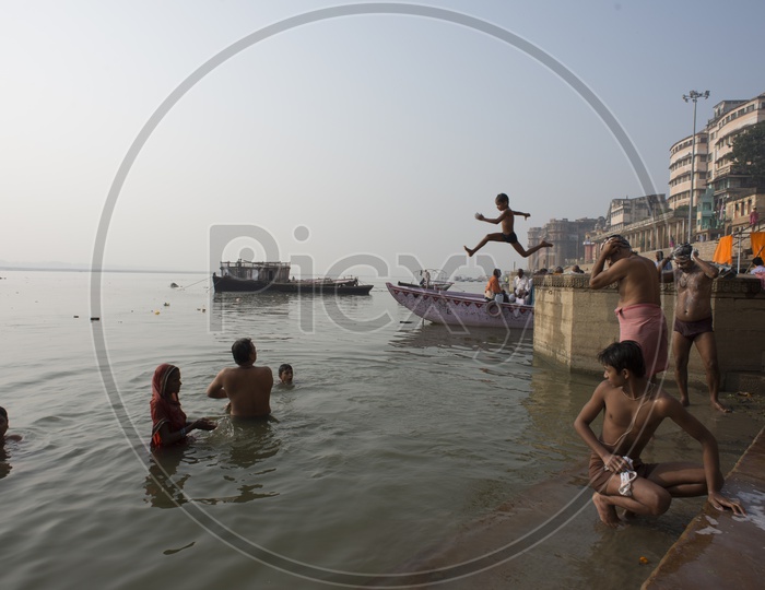 Kid Jumping into the Ganga River at Varanasi