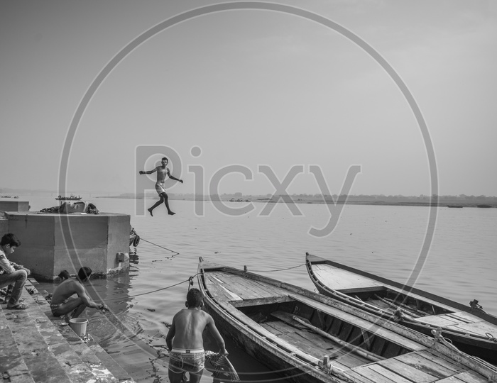 Boy jumping into the Ganga River, Varanasi