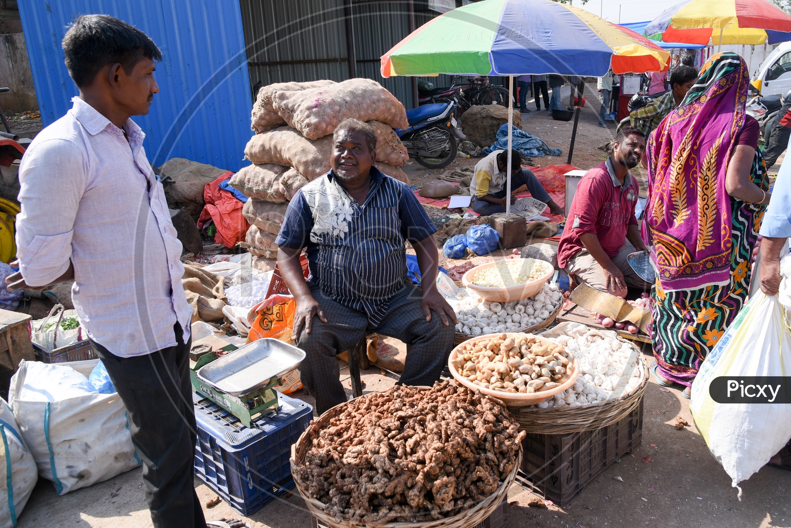 Vendor selling garlic and ginger