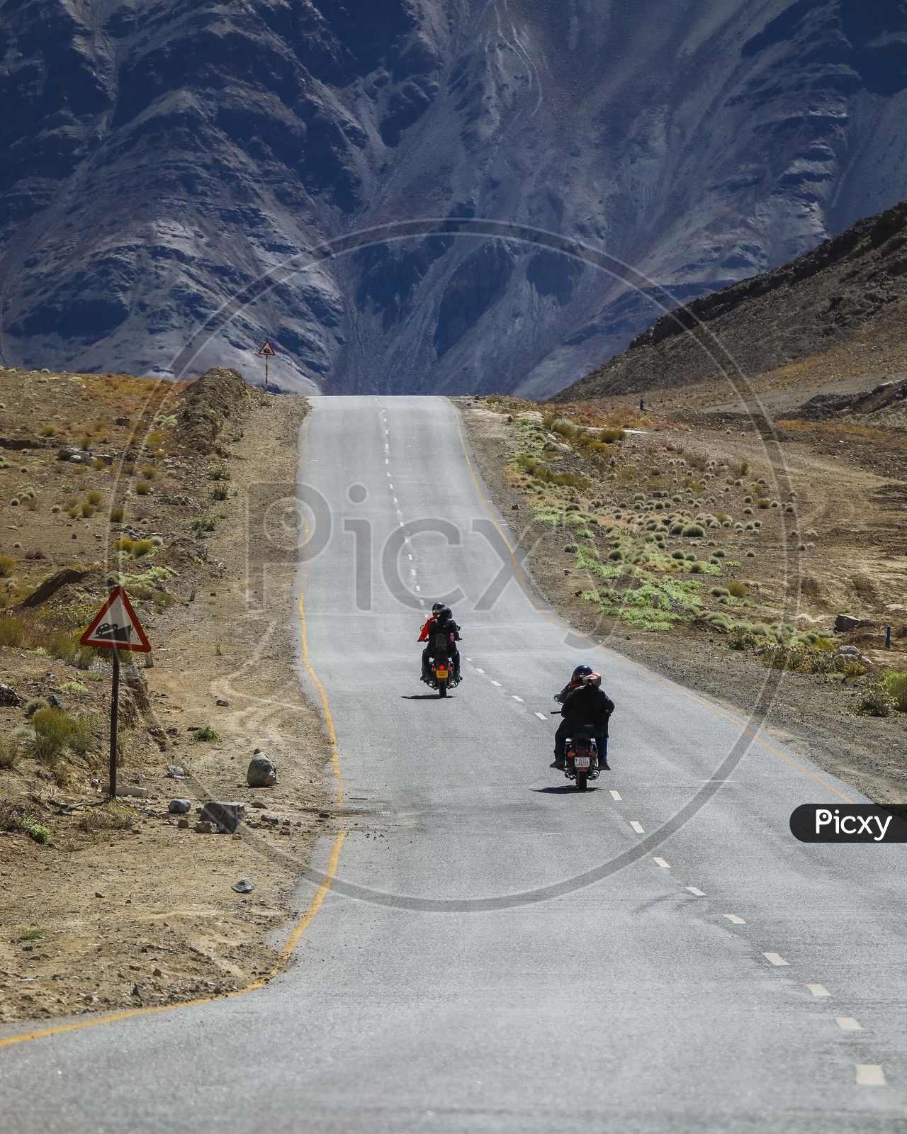 Travellers on bikes in  Hills and snowy Mountains of Leh -Ladakh