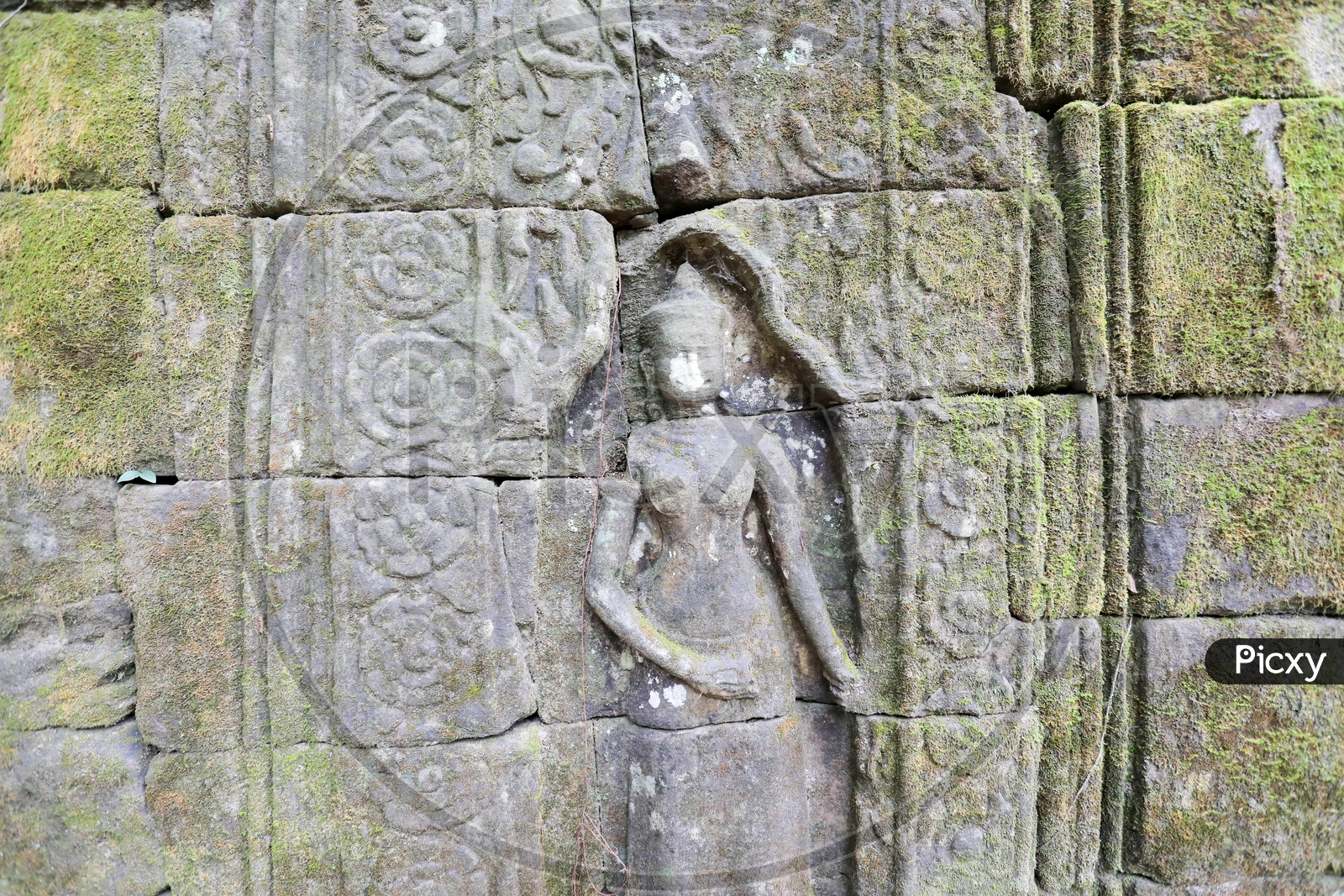 Ancient Statue on Wall Near Ta Prohm