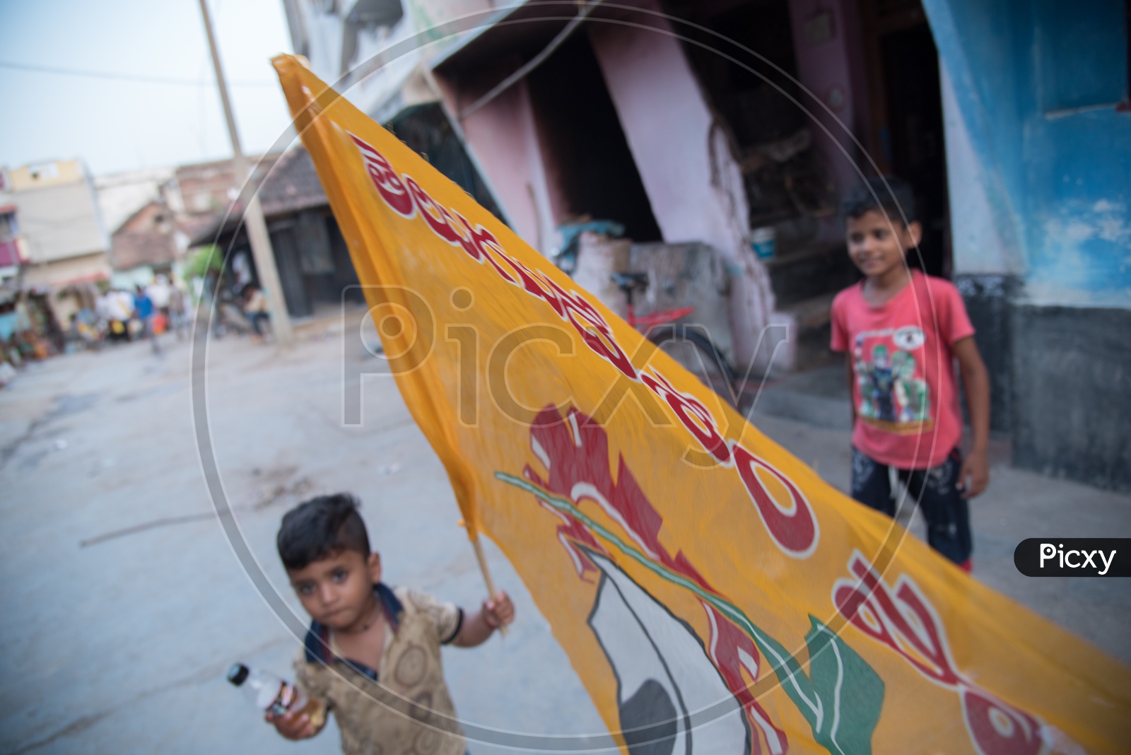 A kid with TDP Party Flag.