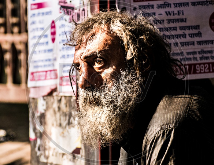 Very old man begging on streets and looking in hope