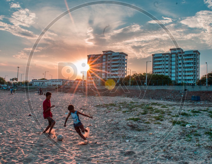 Children Playing Foot ball in Beach