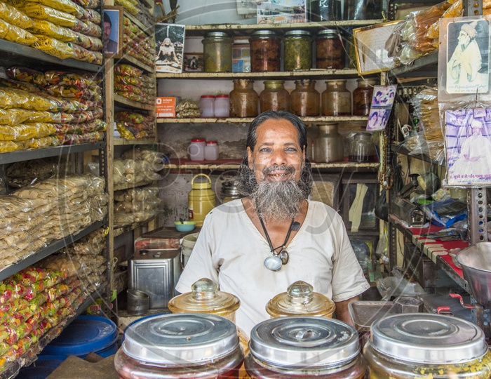 Happy Old Muslim Man in Shop
