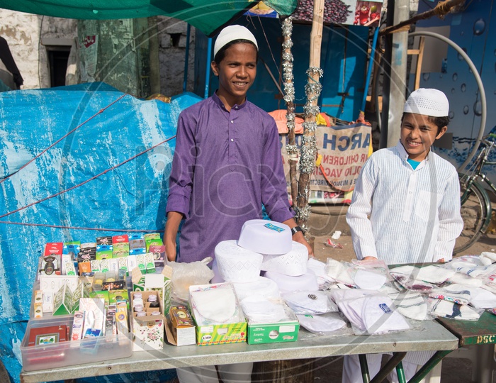Kids selling Attar and caps during Eid festivities in Hyderabad