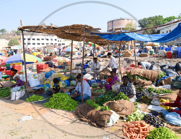 Vendors selling vegetable in shacks