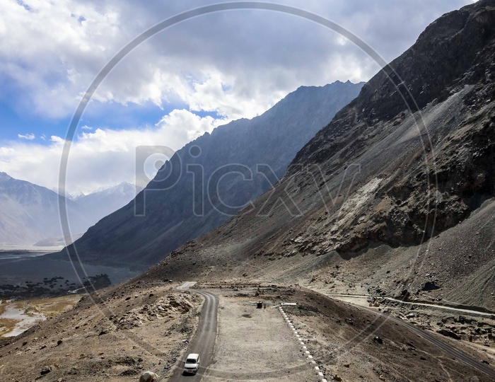 Roads in Leh ladakh region amidst Hills and Snowy Mountains.