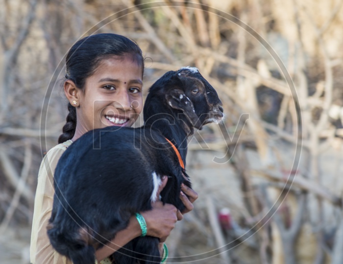 Smiling girl with Goat