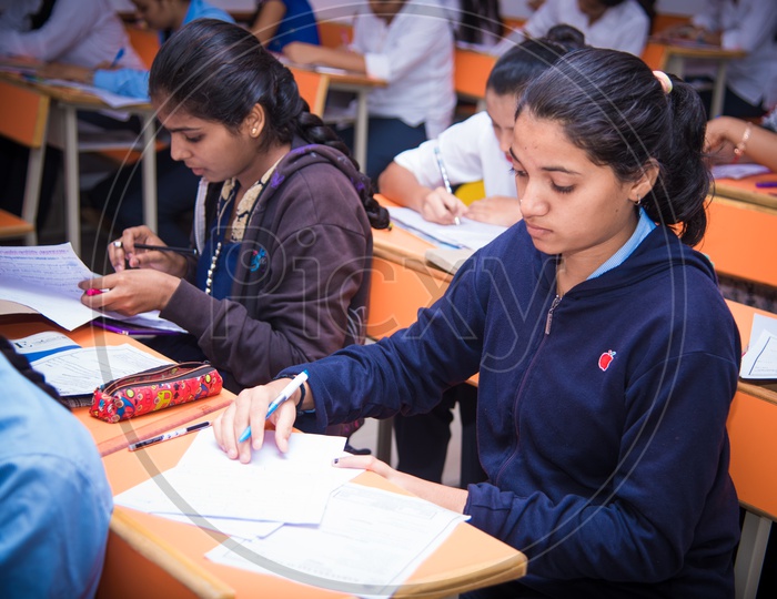 Girl  writes an exam at an educational institution