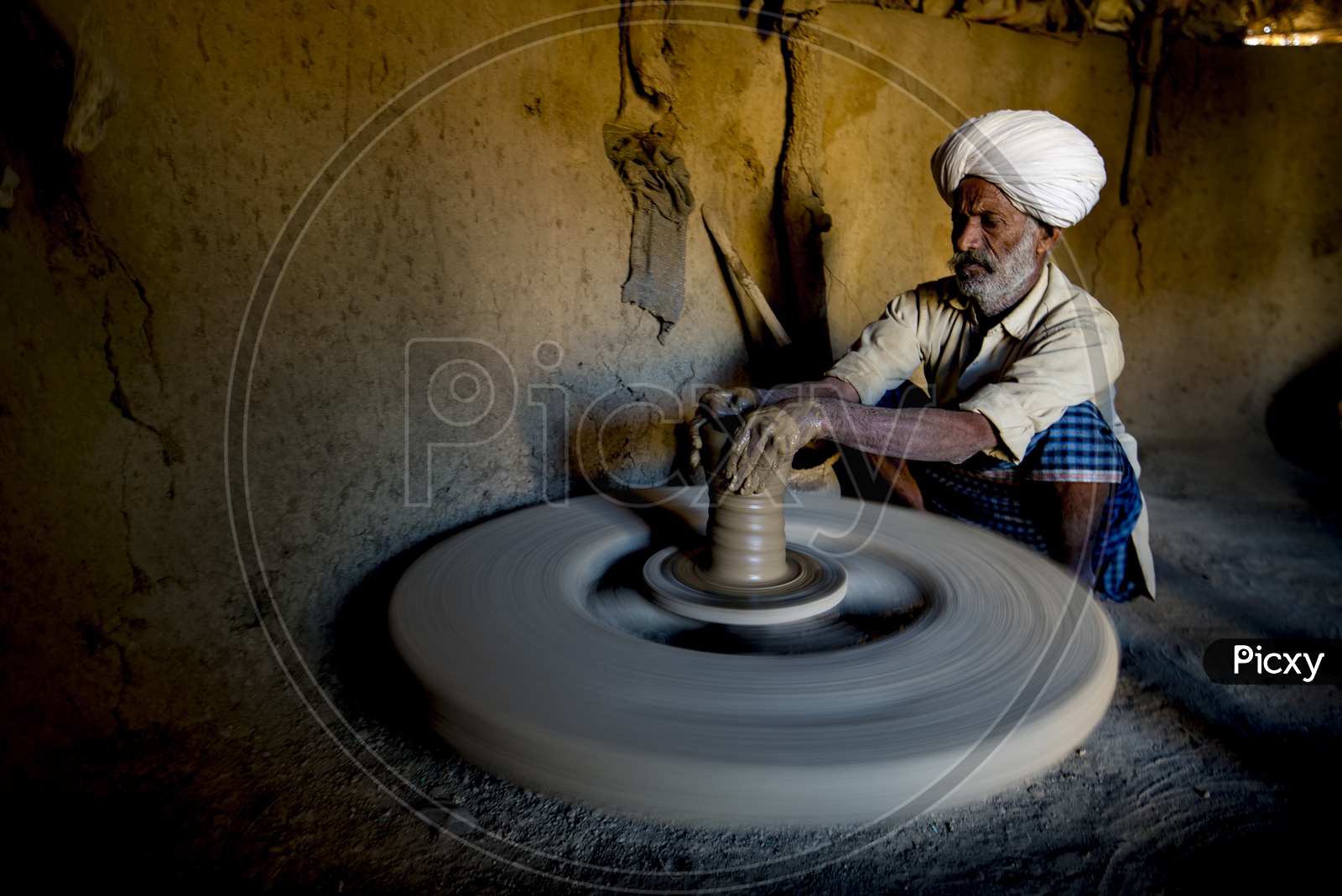 Old Man Making Clay Pot on Pottery Wheel in Ajmer